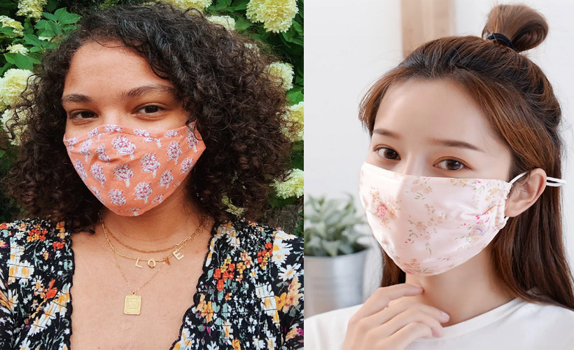 two women wearing patterned face masks