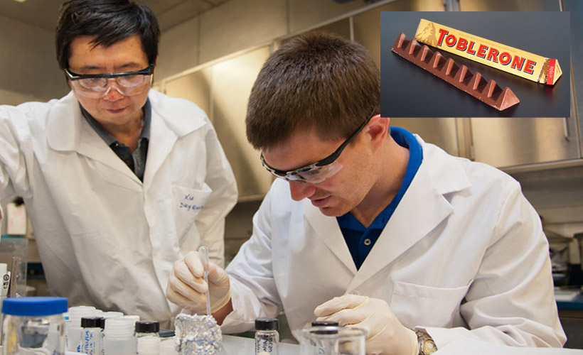 scientists in a lab, picture of toblerone in corner