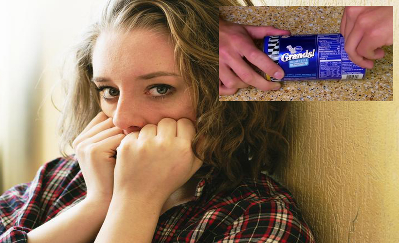 scared woman with pillsbury can being opened in corner