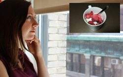 woman thinking about yogurt with little spoon