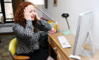 woman crying at desk